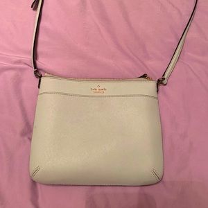 Kate spade purse with shoulder strap.